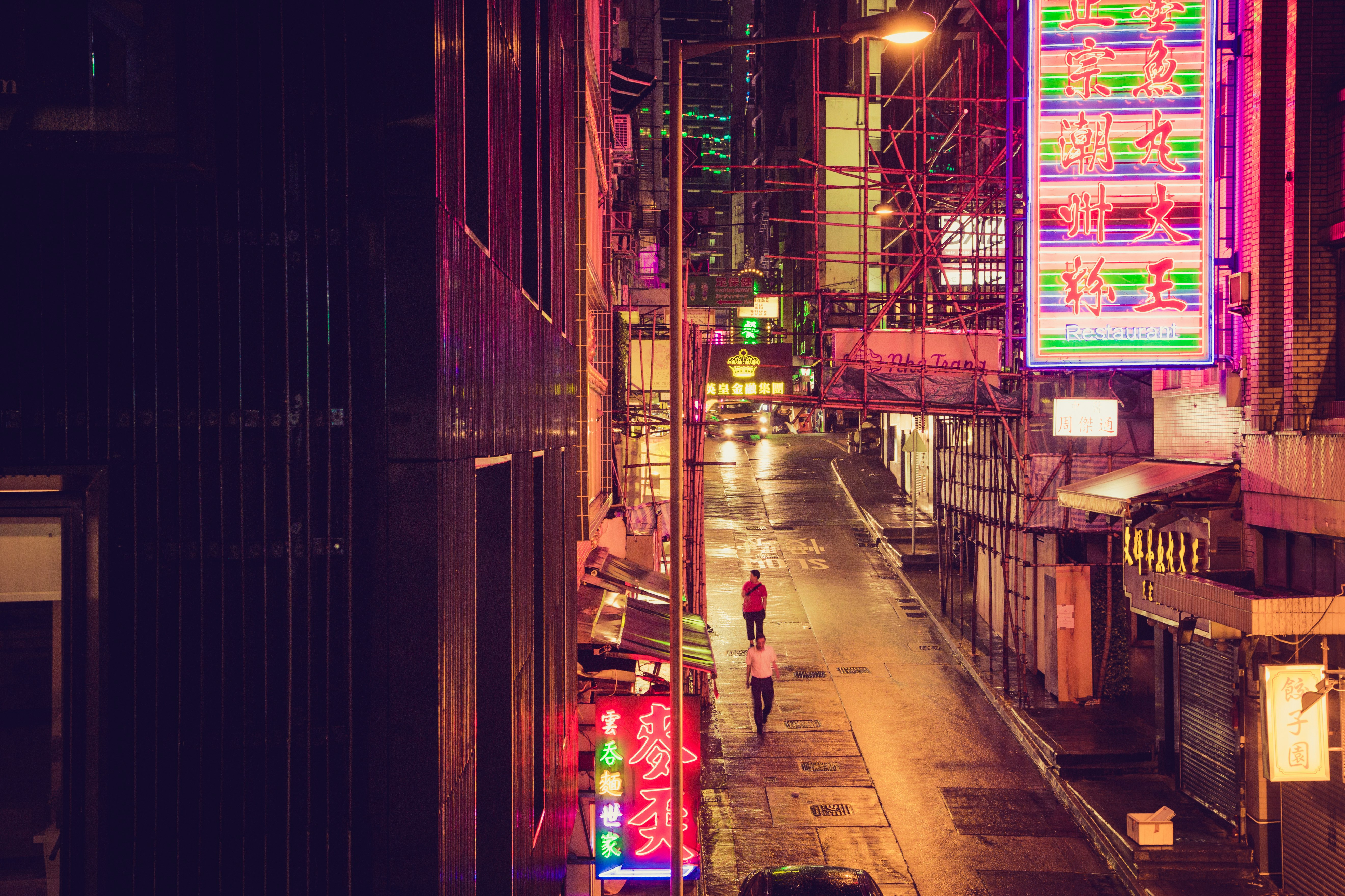 people walking on street during nighttime